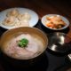 Okdongsik, Pork Gomtang, New York Times, Culinary Recognition, Korean Restaurant, Koreatown NYC, Food Excellence, Comforting Soup, Culinary Sensation, Manhattan Dining